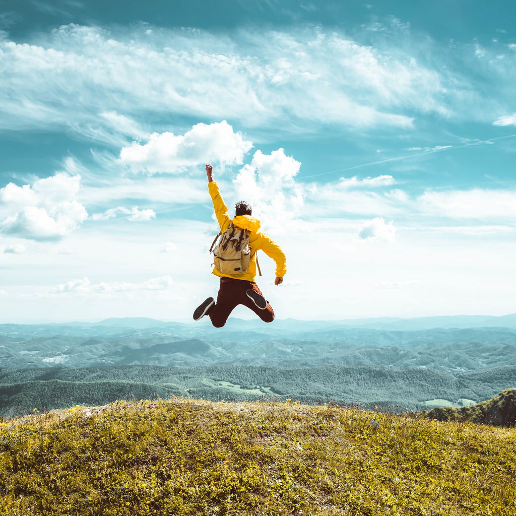 Woman on the beach reaching out her hand, inviting to join
